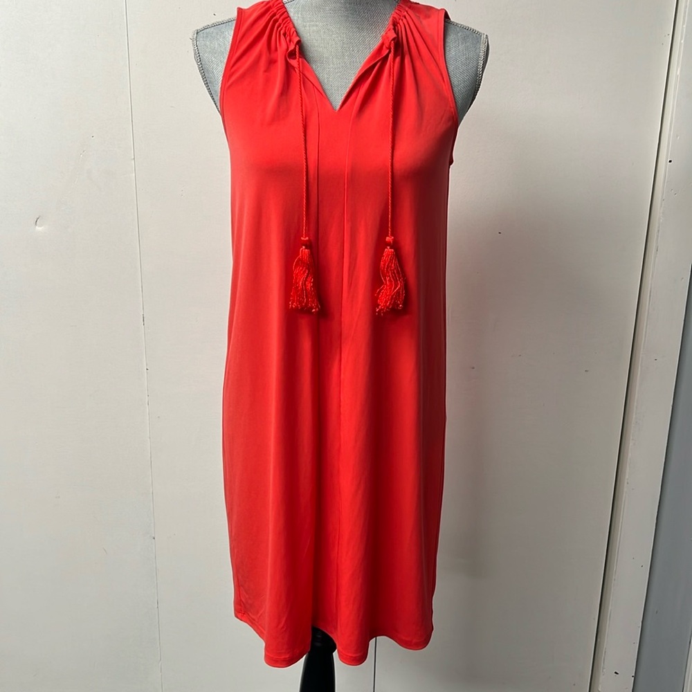 Michael Kors orange, sleeveless knit dress. Simple with unique details